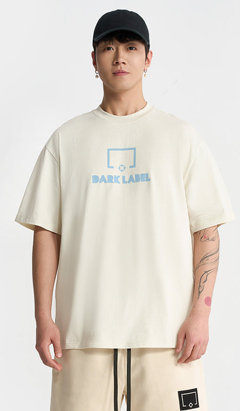 Rigorer Dark Label t-shirt, ivory with blue chest print, worn front view