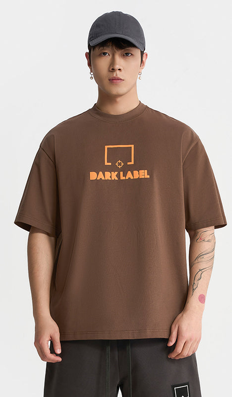 Rigorer cotton t-shirt, coffee brown, worn front view with Dark Label chest print