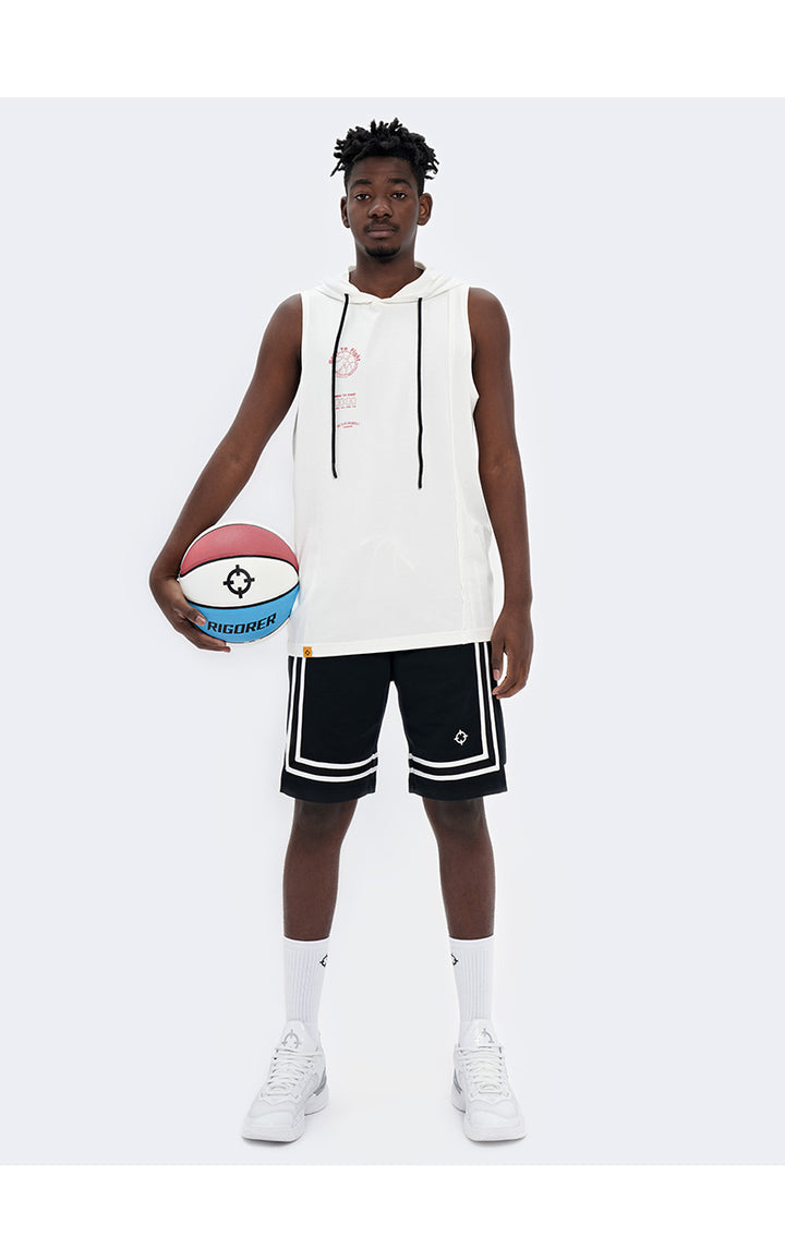 Full length view of the black Rigorer knitted Bermuda shorts worn with a sleeveless hoodie