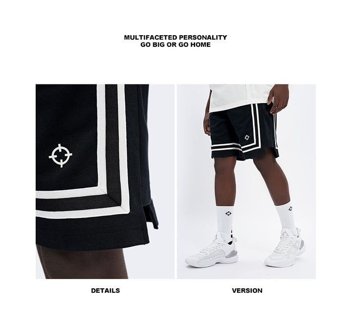 Close up of the white woven side tape and split leg panel on the black shorts