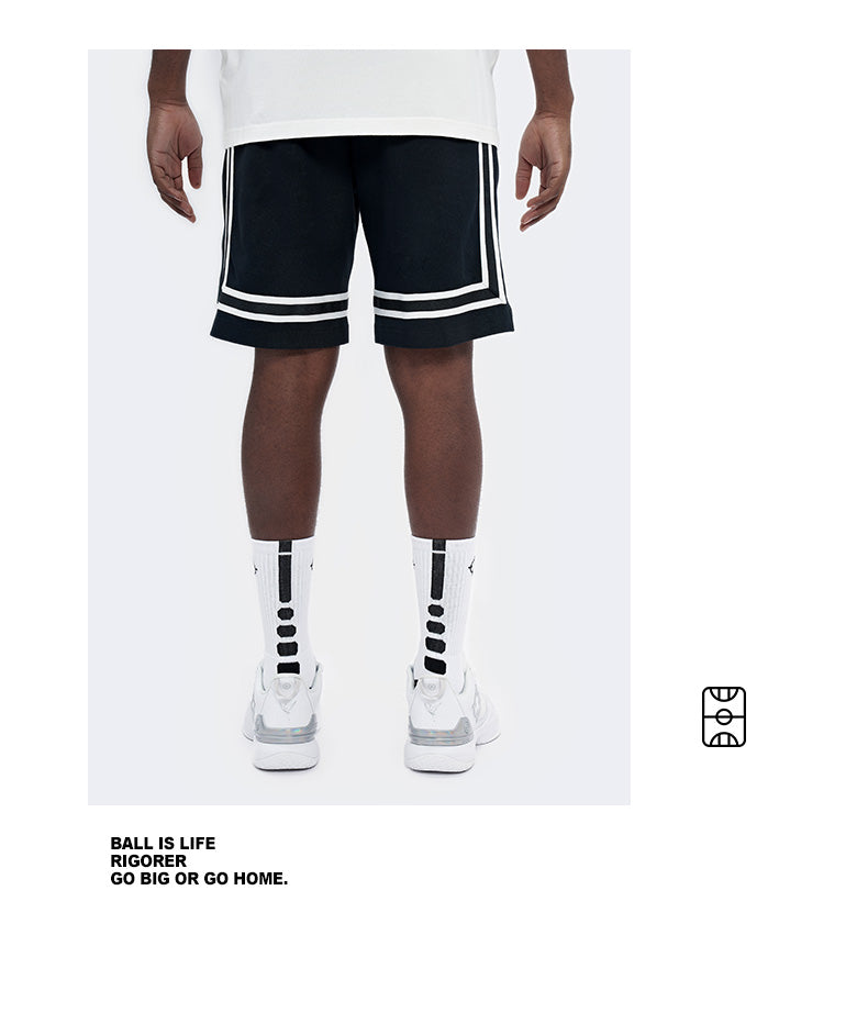 Rigorer knitted Bermuda basketball shorts in black, front view with white side tape
