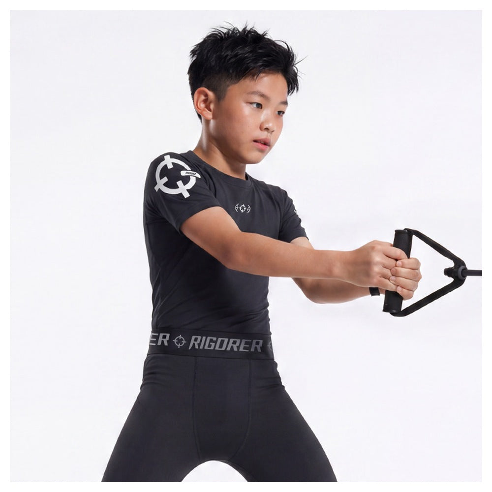 Rigorer kids compression shirt in black, showing the shoulder logo and short sleeve cut